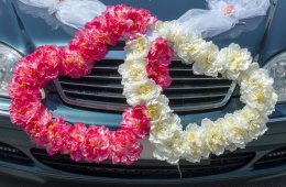 Weddings On The Car With Their Hands